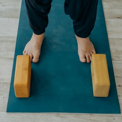 Yoga mat and blocks arranged neatly on the floor.